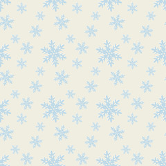 Seamless blue pattern with snowflakes.