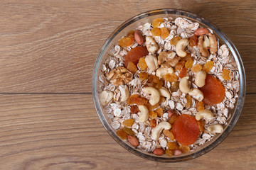 Dry muesli with nuts, raisins and dried apricots. top view