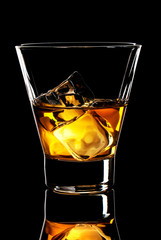Whiskey glass with ice cubes