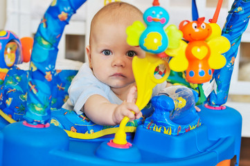 Fototapeta na wymiar funny baby in baby jumper