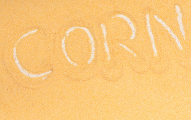 Close up maize meal corn sign food background. Diet nutrition.