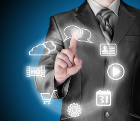 Business man pressing an icon in air