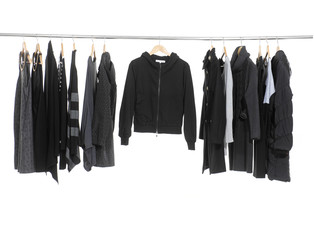 Variety of casual fashion clothing hanging on hangers
