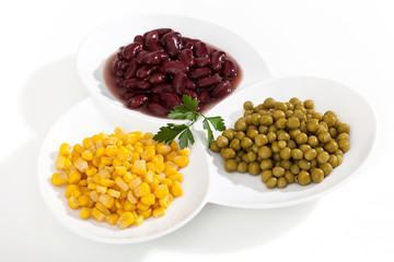 Corn,peas and beans on white bowls