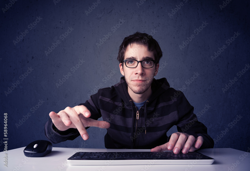Fototapete Hacker working with keyboard on blue background
