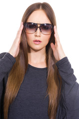 Naklejka premium attractive young girl in sunglasses posing