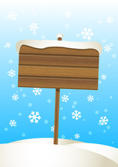 Obraz premium Wooden plate on the snow
