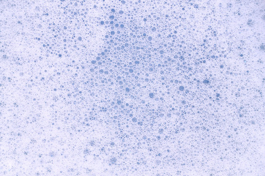 Bubble foam soap in blue water.