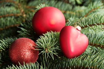 Obraz na płótnie Canvas Three christmas balls on a tree.