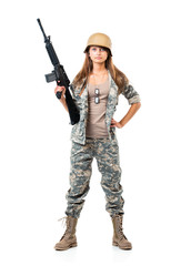Fototapeta premium Soldier young beautiful girl dressed in a camouflage with a gun