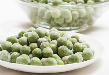 frozen peas close up in white background