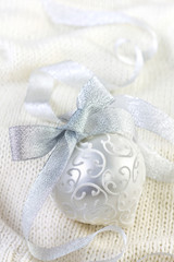 Christmas ball on knit background