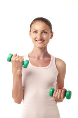 The girl with dumbbells in hands