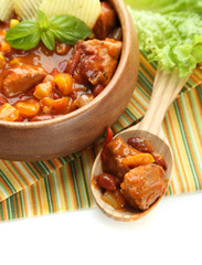 Chili Corn Carne - traditional mexican food, in wooden bowl,