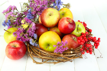 Juicy apples on white wooden table