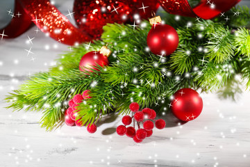 Christmas balls on fir tree, on wooden background