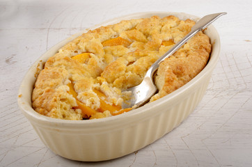 warm home made peach crumble cake