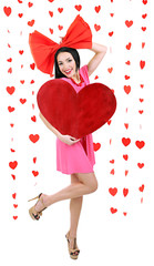 Attractive young woman with heart on Valentine Day