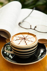 cup of coffee with book