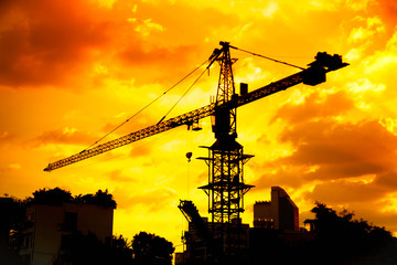 silhouettes of Industrial construction crane