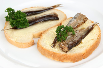 Tasty sandwiches with sardines, close-up