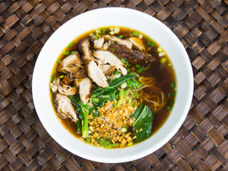Duck noodle soup on bamboo