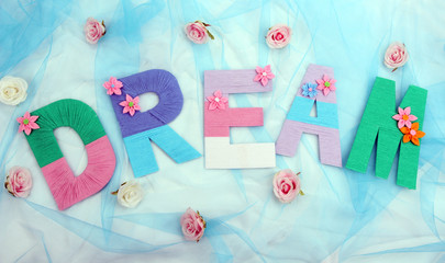 Word Dream created with brightly colored knitting yard