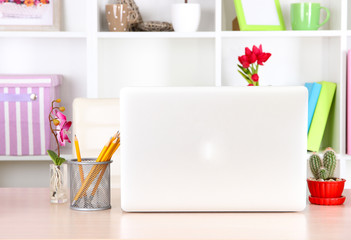 Workplace with laptop, close up