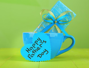 Happy Fathers Day tag with gift box and cup,
