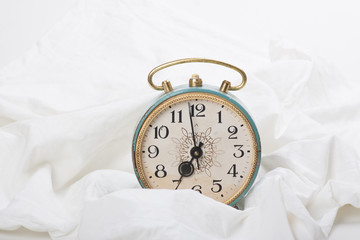 Alarm clock on the bed