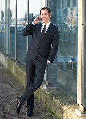 Portrait of a happy business man talking on mobile phone