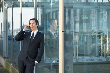 Portrait of a smiling businessman calling by mobile phone