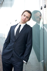 Business man standing alone outdoors