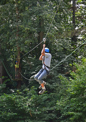 Teenage boy zipping down