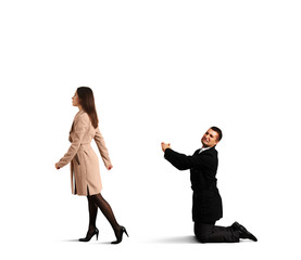 man bending the knee before woman