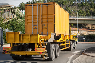 yellow container on truck