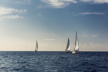 Sailing ship yachts with white sails