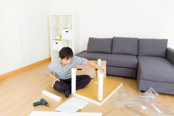 Man assembling table