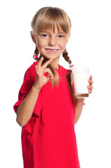 Little girl with glass of milk