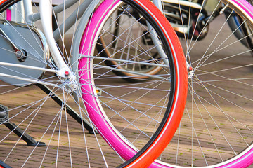 Two bicycles with colorful wheels parked. Netherlands