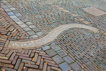 The inscription on the sidewalk in Dordrecht. Netherlands