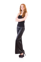 Redhead woman in black bell bottom pants on white