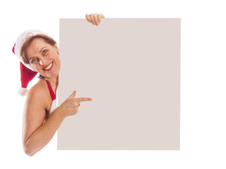 attractive woman with Santa Claus outfit holding white signboard - 59009616