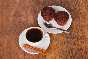 Cup of coffee with chocolate muffins