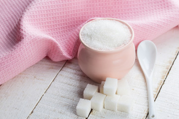 Sugar on wooden background