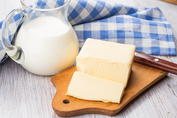 Fresh butter on wooden board.