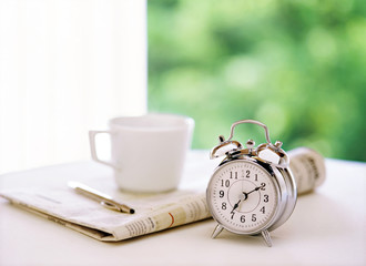 alarm clock and newspaper