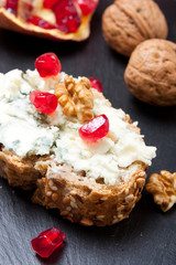 Blue cheese with pomegranate and nuts