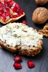 Blue cheese with pomegranate and nuts