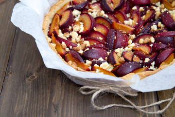 Plum tart on a wooden table